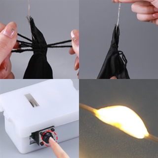 Hængende Halloween-spøgelse med heksehat og varmt hvidt lys