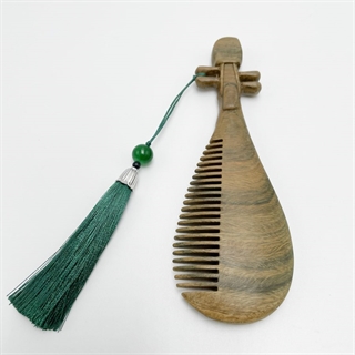 Orientalsk trækam med grøn kvast